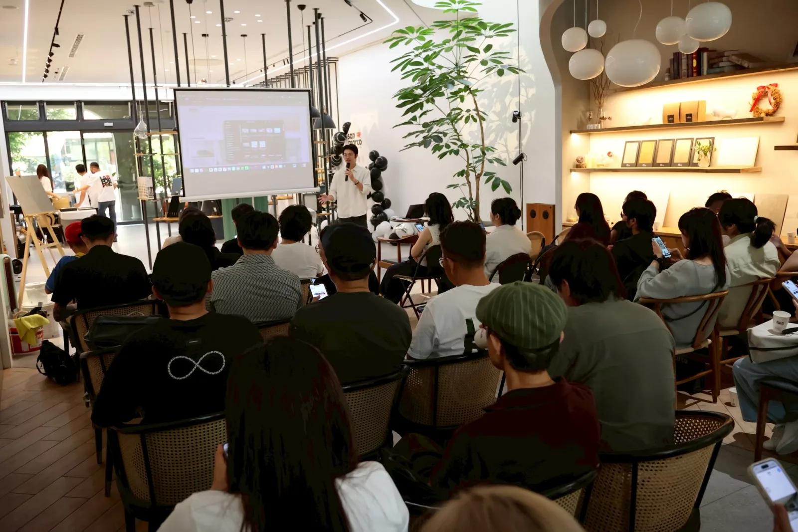 San Marco × Atarashi designer salon: a room full of interior designers watching the AI visualizer on a projector